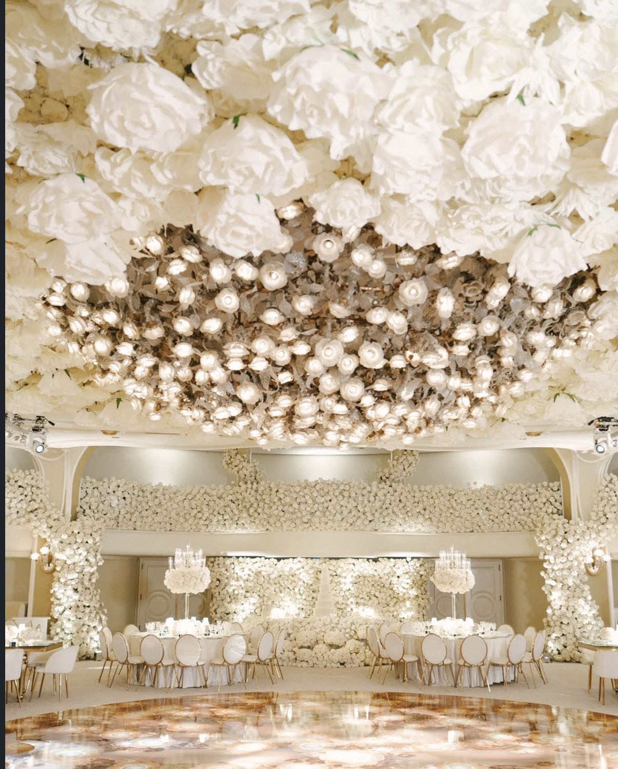 Couple beneath an immersive white floral ceiling
