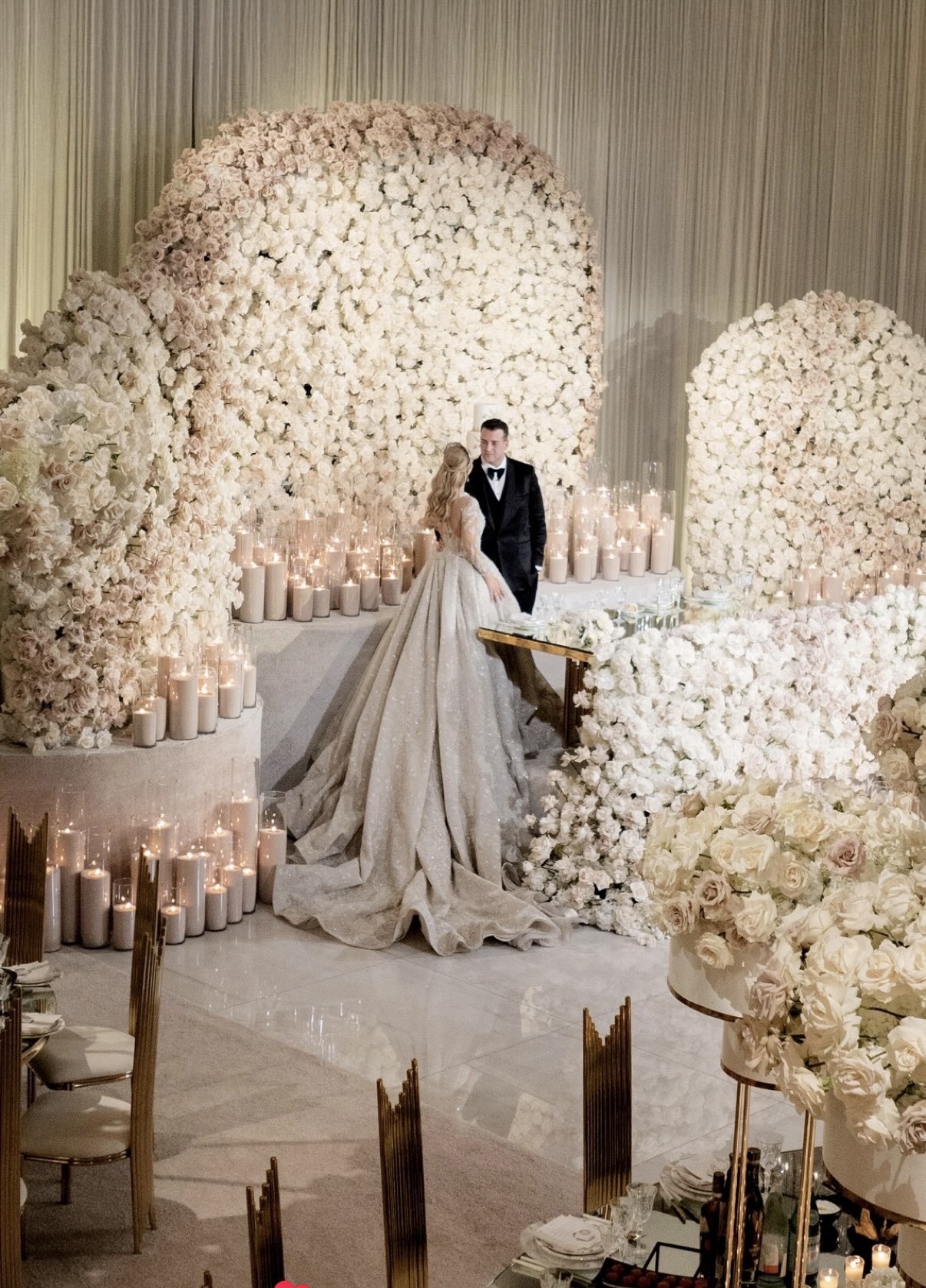 Opulent ivory rose installation with candlelight