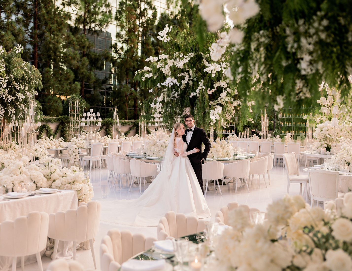 Newlyweds among lush white florals designed by Dolce Fiore
