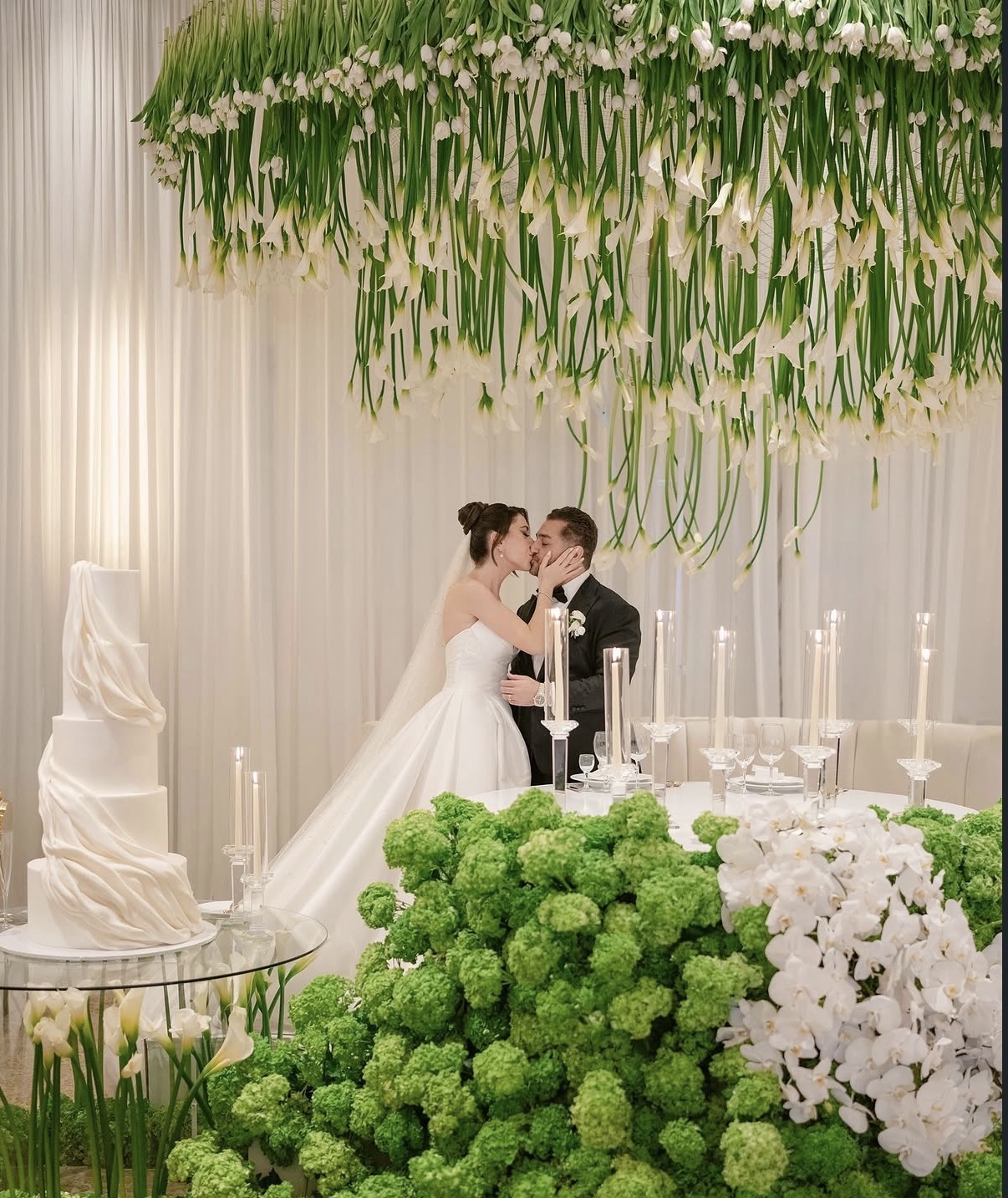 Calla lily installation over a wedding couple